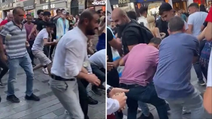 Görüntüler Taksim'den! Yere atılan 1 dolarları almak için birbirlerini ezdiler