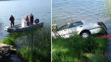 Fotoğraf çekmek isteyen adamın hatası pahalıya patladı! El frenini çekmeyi unuttuğu aracı göle uçtu